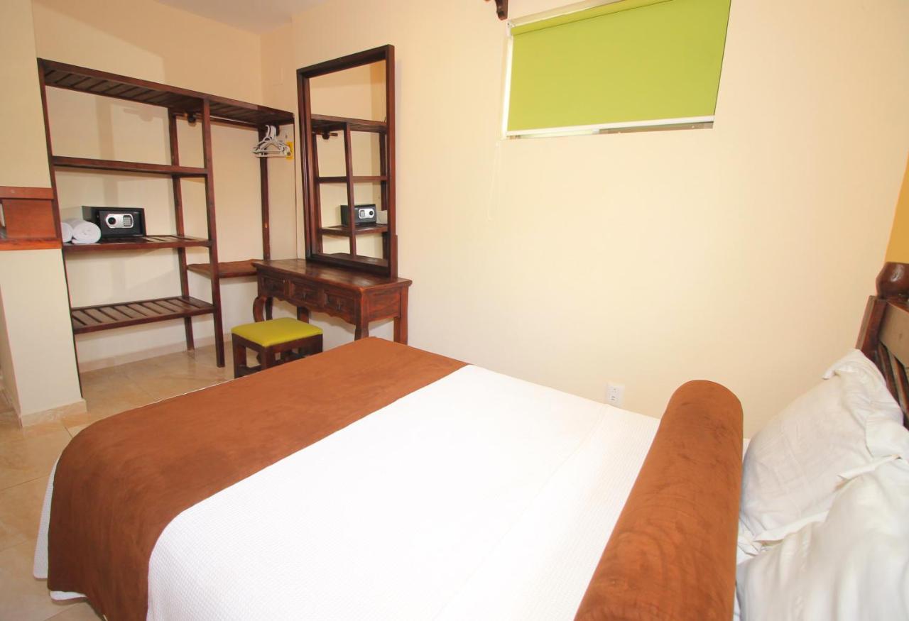 Papagayo Hotel Boutique 신데 델 카르멘 외부 사진 A bedroom at the hotel