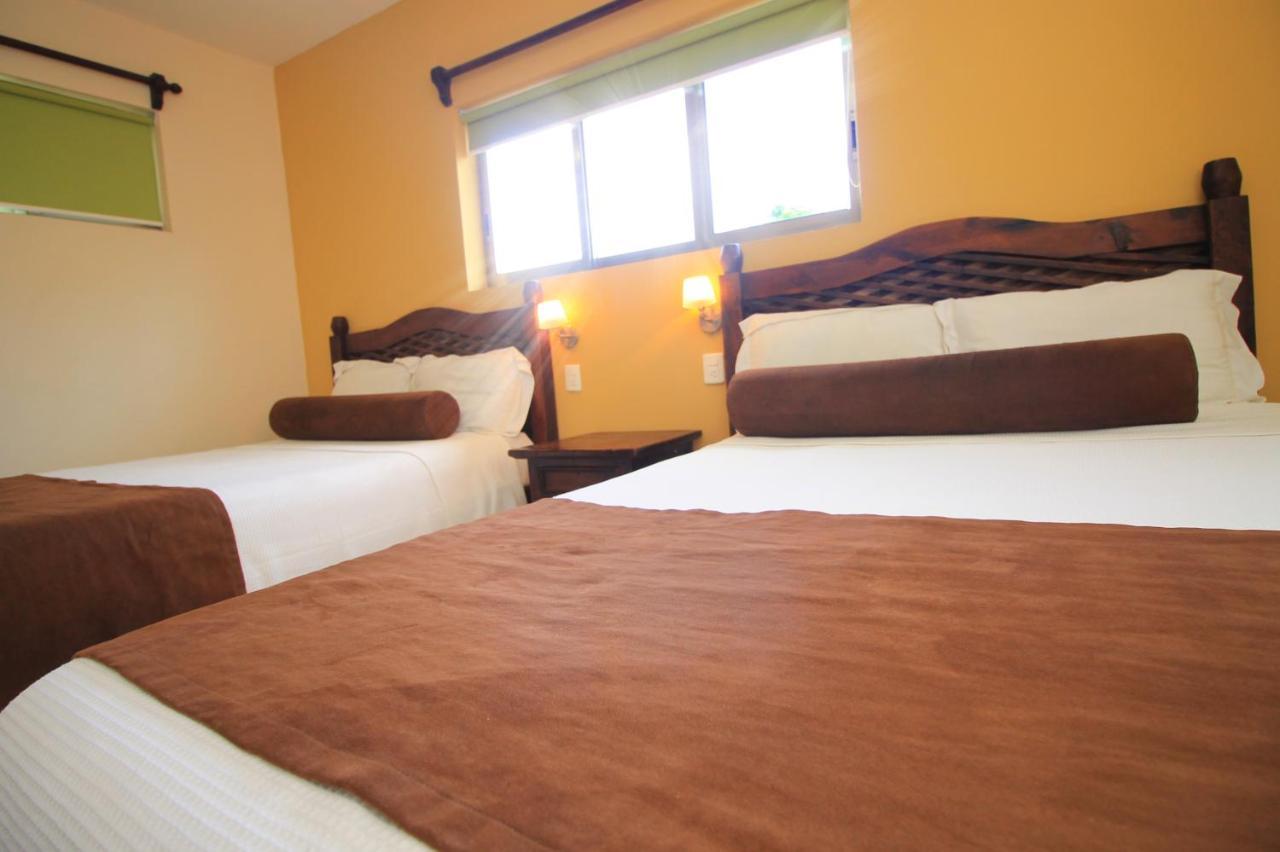 Papagayo Hotel Boutique 신데 델 카르멘 외부 사진 A room at the hotel